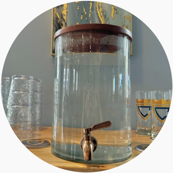 Glass beverage dispenser and Citadel-branded glasses